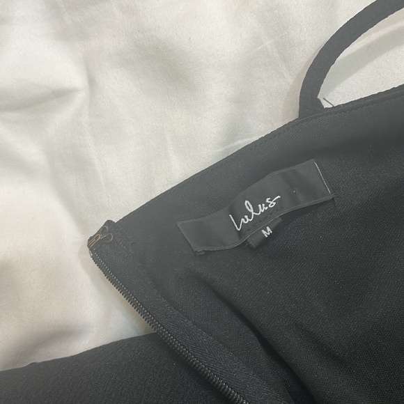 A size medium, but stretchy! Never worn, bought for hoco. This dress is so nice. - Picture 3 of 4